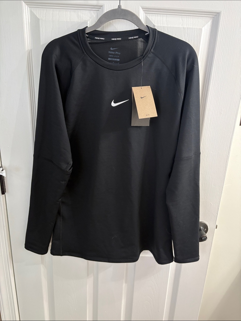Nike Black Long Sleeve Performance Shirt with White Swoosh